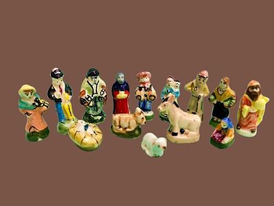 A collection of traditional French f&egrave;ve miniatures, designed as santons - small handmade 