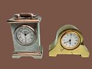 Miniature metal table/shelf clocks. Made of metal in gold and silver tones. 
Not tested for Image - 1
