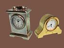 Miniature metal table/shelf clocks. Made of metal in gold and silver tones. 
Not tested for Image - 2