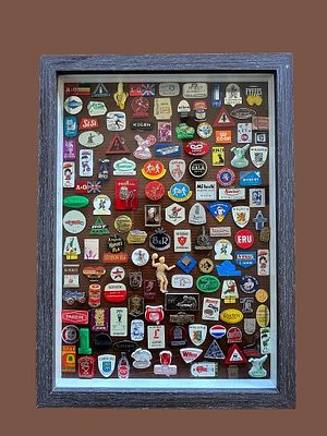 Collection of vintage metal badges and pins from Europe and the United States. Includes a 