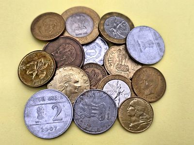 Collection of coins from different countries around the world. Unsorted 
Year range is expanding.