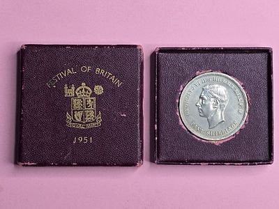 A "Crown" commemorative coin issued in 1951 in honor of the "Festival of Britain". Denomination: 