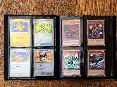 Mixed collectible card album. Including Pokemon, Yu-Gi-Oh, Football, Marvel and Baseball. 
The 