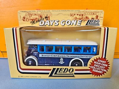 A collectible diecast model of a "Burnley Corporation Tramways & Omnibuses" bus from the 