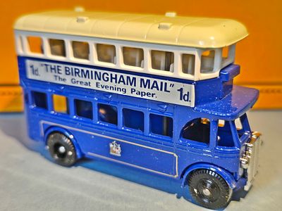 A collectible diecast model of a 1932 AEC Regent double-decker bus, produced by Lledo as part 