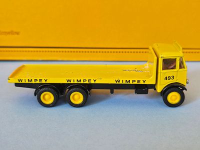 Diecast model of an EFE 1/76 Scale E10703 AEC Mammoth 6 Wheel Flatbed truck in yellow, branded 