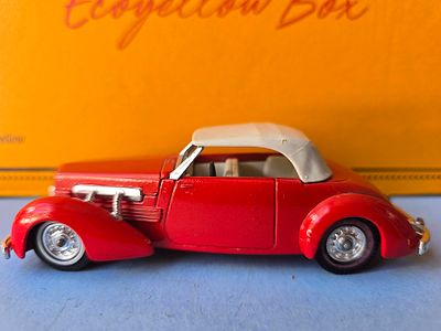 A rare collectible metal model of a 1937 Cord Model 812 Supercharged Convertible Phaeton Sedan 