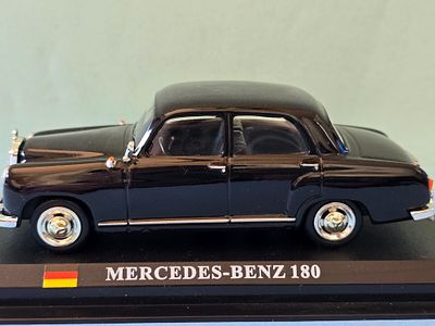 A collectible metal model of a Mercedes-Benz 180 from the "Ponton" series (W120). . The model 