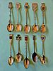 A collection of souvenir spoons representing various historical and geographical destinations Image - 1