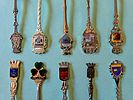 A collection of souvenir spoons representing various historical and geographical destinations Image - 2