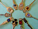 A collection of souvenir spoons representing various historical and geographical destinations Image - 3