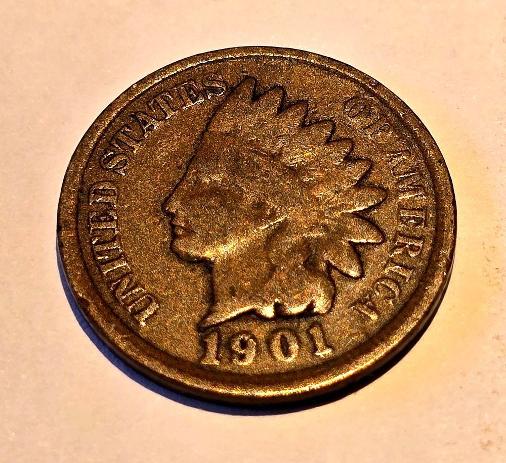 American "Indian Head Cent" coin from 1901. The coin depicts the image of "Liberty" wearing a 