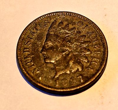 American "Indian Head Cent" coin from 1807. The coin depicts the image of "Liberty" wearing a 
