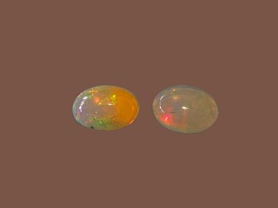 A pair of natural Ethiopian opals, known for their spectacular play of colors (fire opal). 