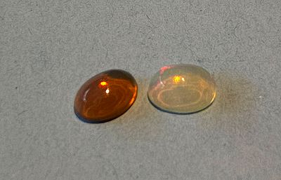A pair of natural Ethiopian opals, known for their spectacular play of colors (fire opal). 