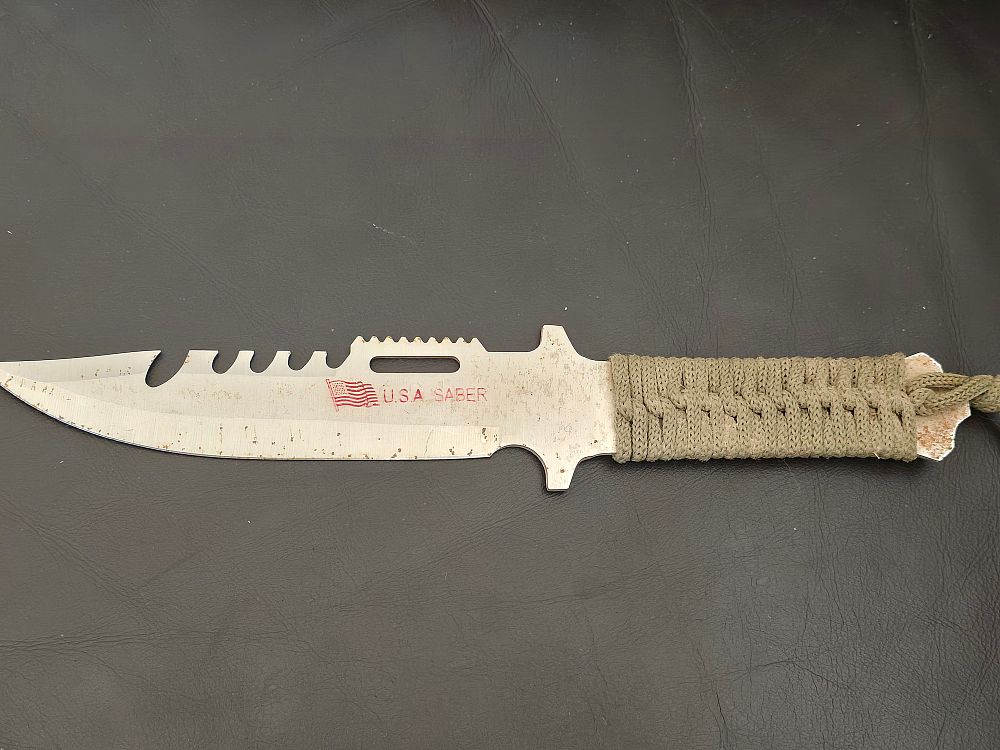 Hunting/commando/survival knife made in the U.S.A. Saber. Blade: Made of stainless steel, with 