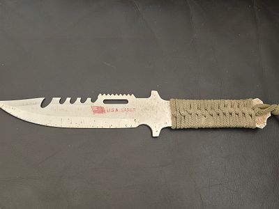 Hunting/commando/survival knife made in the U.S.A. Saber. Blade: Made of stainless steel, with 