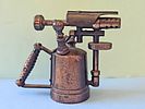 A vintage cast metal pencil sharpener in the shape of a gas burner (Blowtorch), usually Image - 1