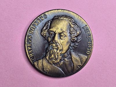 A commemorative bronze medal commemorating Charles Dickens (1812–1870), the renowned British 