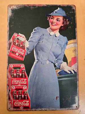 A decorative metal sign designed in a vintage style featuring an advertisement from the 1940s 