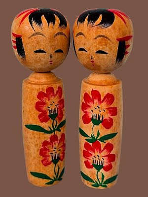 A pair of traditional vintage Japanese wooden Kokeshi dolls. These dolls originate from the 