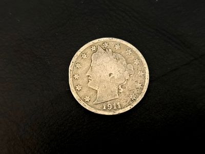 A 1911 American Liberty Head "V" Nickel coin.