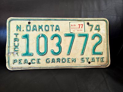 Original vintage metal license plate from 1974 for trucks ("TRUCK") from the state of North Dakota..