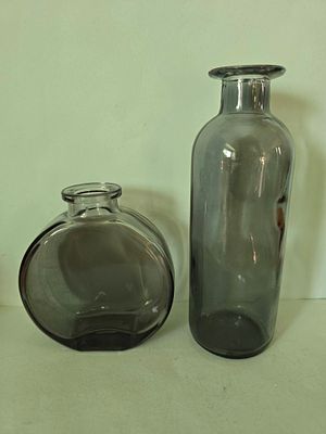 Pair of glass vases in a smoky gray shade. Average height 10 to 15 cm.
