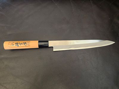 Traditional Japanese Yanagiba knife - a professional chef's knife. The manufacturer (Hanko) 