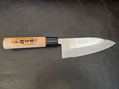 Traditional Japanese "Deba" knife - a professional chef's knife. The manufacturer (Hanko) 