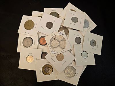A collection of vintage coins from various countries. Coins are packaged in cardboard coin 