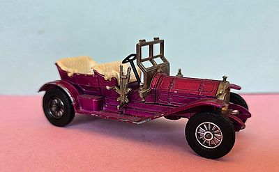 A collectible die-cast model from the Matchbox Models Thomas Flyabout 1909 series. The vehicle 
