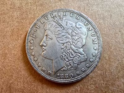 A high-quality replica of an American Morgan Silver Dollar coin from 1880.