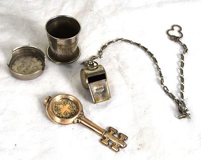 Silver Wine Tester. Sterling silver wine taster along with a metal whistle and collapsible cup. 