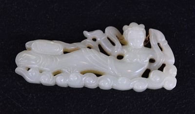 Early Jade Goddess. Intricately and early carved goddess on a base of sea waves. Dimensions: 3.5" L