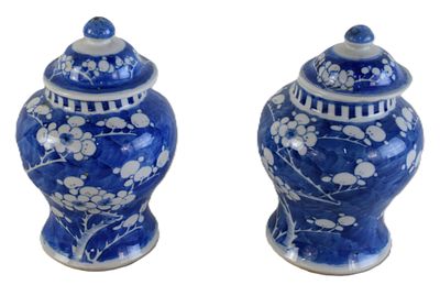 Pair Of Chinese Jars. Pair of Chinese glazed porcelain jars with lids and with floral design and 