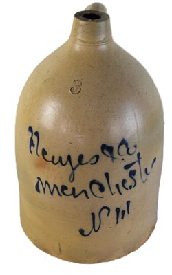 Stoneware Jug. Stoneware jug with handle and with cobalt blue design reading "Heuges-Manchester 