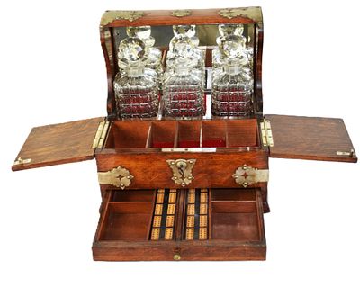 Tantalus Liquor Set. Fine 19th Century tantalus liquor set with three cut crystal decanters with 