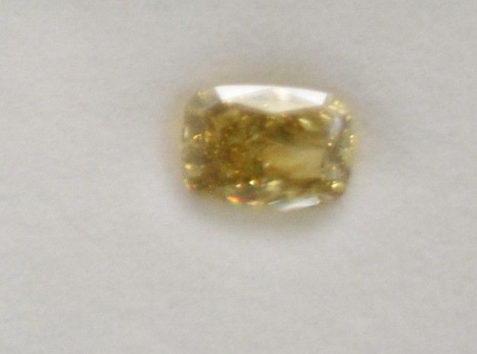 Lot 13: 10.68 Carat Fancy Vivid Yellow Diamond VS1