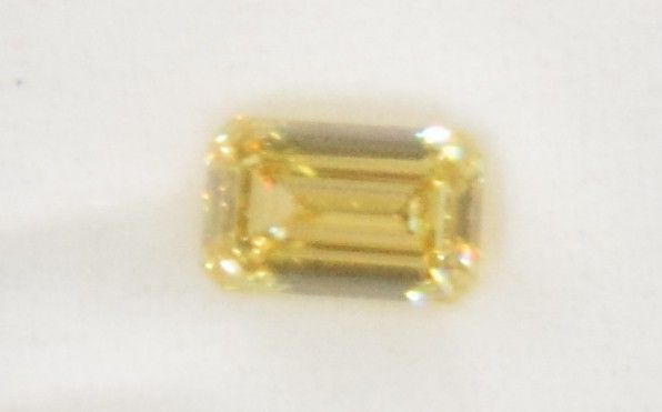 Lot 23: 5.03 Carat Fancy Intense Yellow Diamond VS1