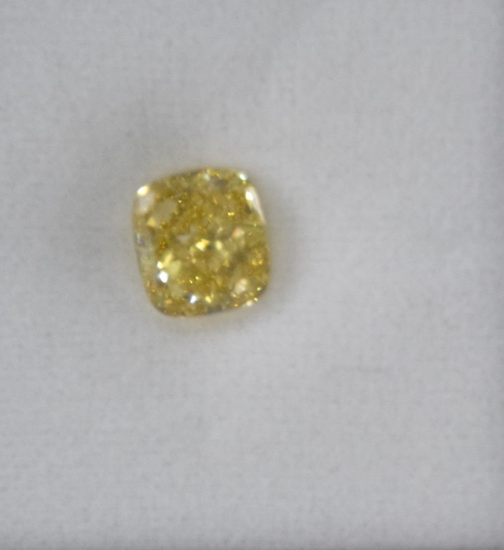 Lot 24: 4.01 Carat Fancy Intense Yellow Diamond VS1