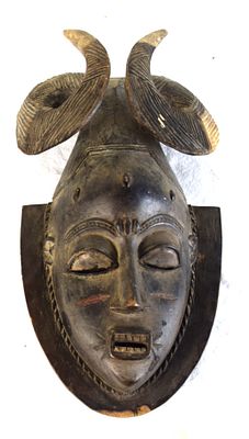 Baule-style horned mask from C&ocirc;te d’Ivoire (Ivory Coast),. Baule-style, hand carved wood, horned 