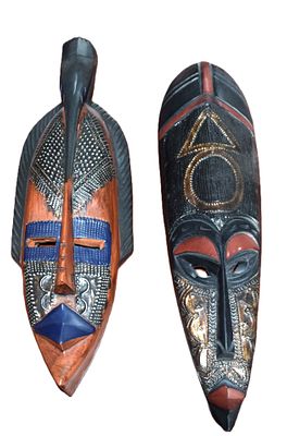 Two Western African Tribal Masks. Two Western African hand-carved sese wood tribal masks, one of 