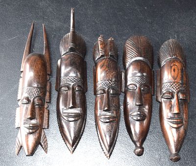 Five Small Western African Carved Figures. Five small Western African wall hanging figures of 