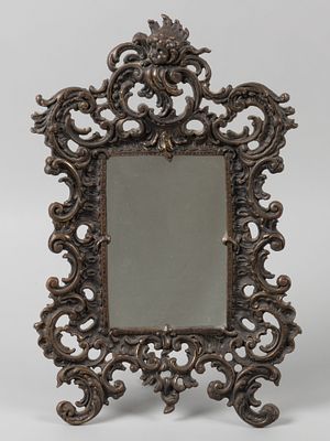 Рама настольная. В стиле рококо. С зеркалом. XX век. Металлический сплав. Размер 31,5х21,5 см. Х 