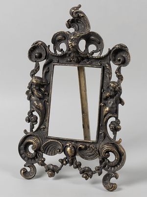 Рама настольная. В стиле рококо. XX век. Металлический сплав. Размер 31х20 см. Размер окна 13х9 см.