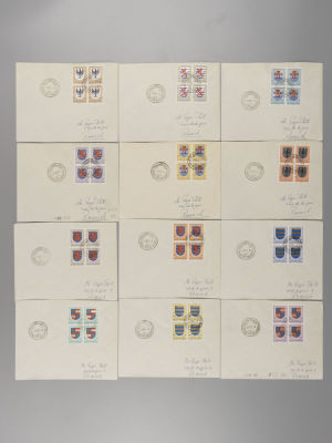 Набор из 12 конвертов с наклеенными квартблоками марок и спецгашениями, прошедших почту. 