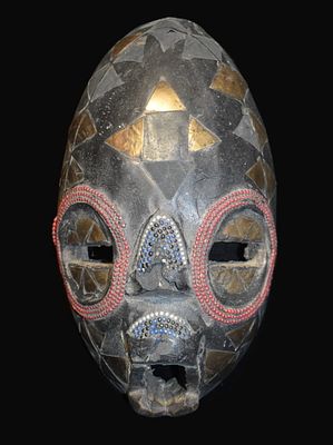 11 1/2" Ghanaian Akan Carved Wood Mask. Hand-carved wooden mask of elongated oval form featuring 