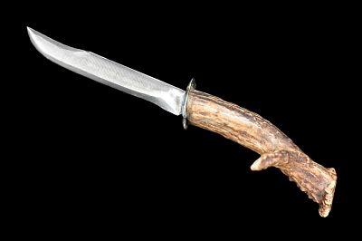 Hand-Forged Hunting Knife with Antler Handle. A finely hand-forged hunting knife featuring a 
