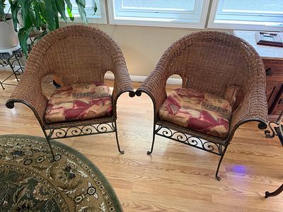 Two Pier 1 Imports Iron & Wicker Arm Chair. Overall good condition. Cushions included. Some 